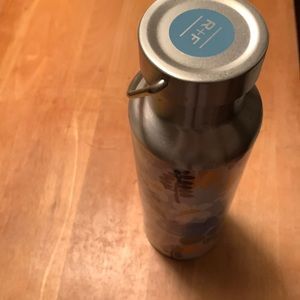 Rodan + Fields water bottle with floral design